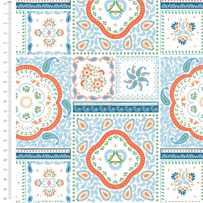 Patterned fabric with colorful designs on a white background, featuring a ruler for scale.