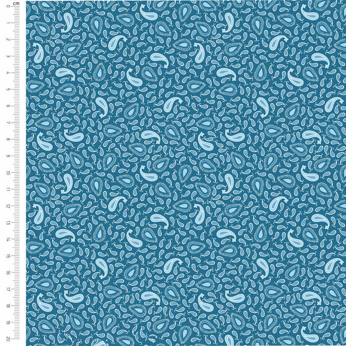 Blue fabric with white paisley pattern and a ruler on the side