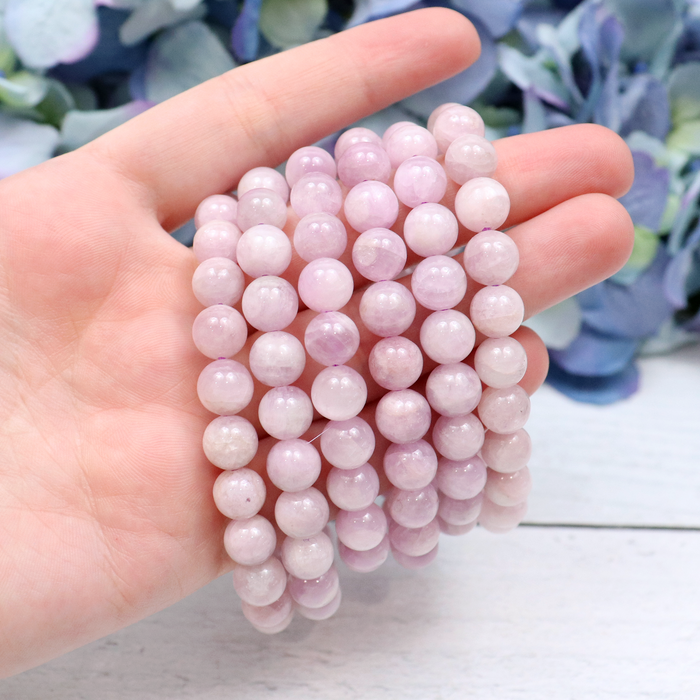 Close-up of natural Kunzite beads showing colour and pattern