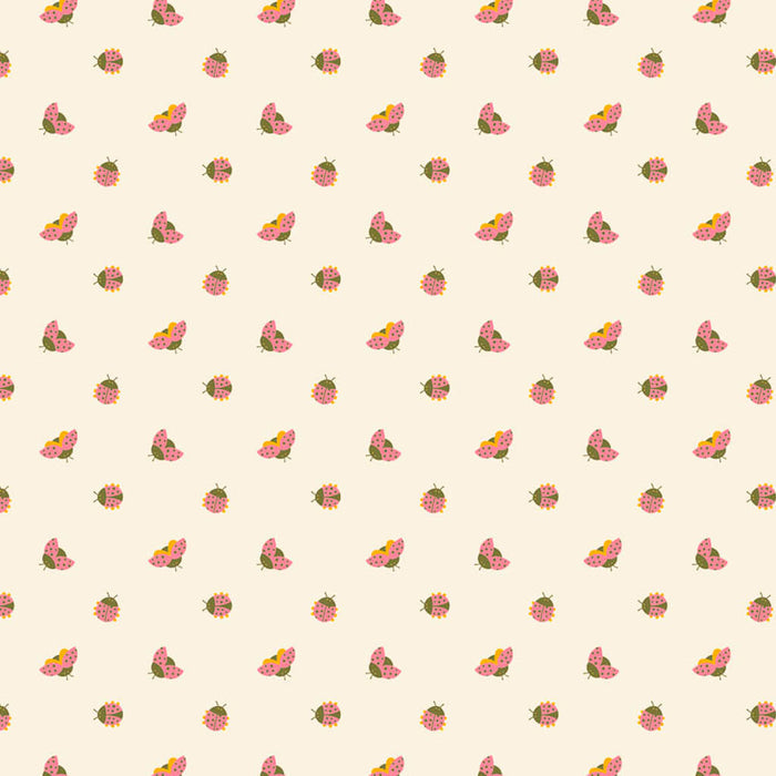 Ladybirds printed on a cream cotton quilting fabric