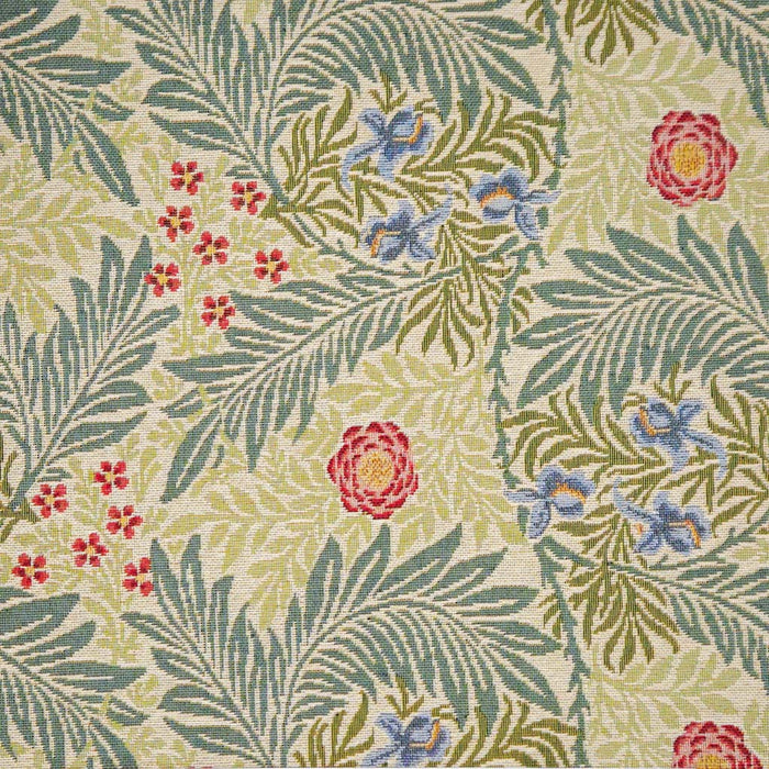 Floral and leaf pattern with red, blue, and green colors on a textured fabric background.