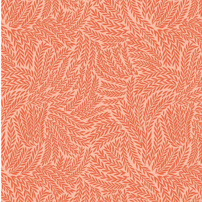 A textured leaf design on orange quilting fabric
