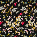 Pattern of colourful leaves on a textured black linen fabric