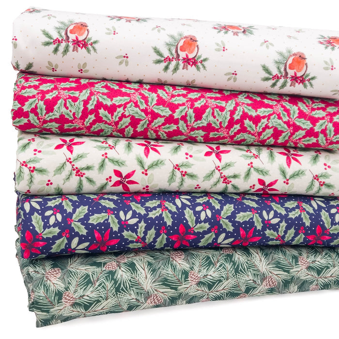 A fat quarter bundle of five fabrics, each featuring a different Christmas-themed pattern including birds, holly, poinsettias, pinecones, and pine needles in festive colors like pink, green, navy, and beige.