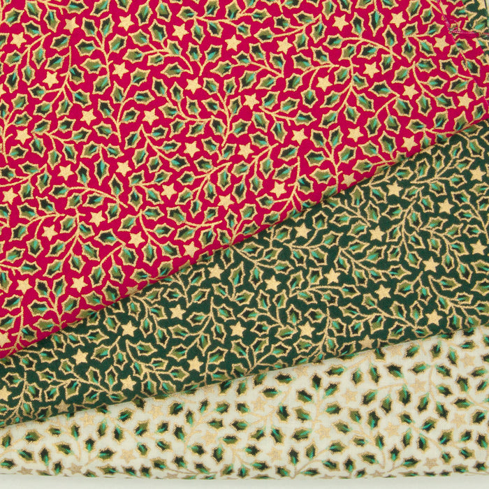 Mini holly and stars in a gold lacquer are printed on red, green and ivory 100% cotton christmas fabric