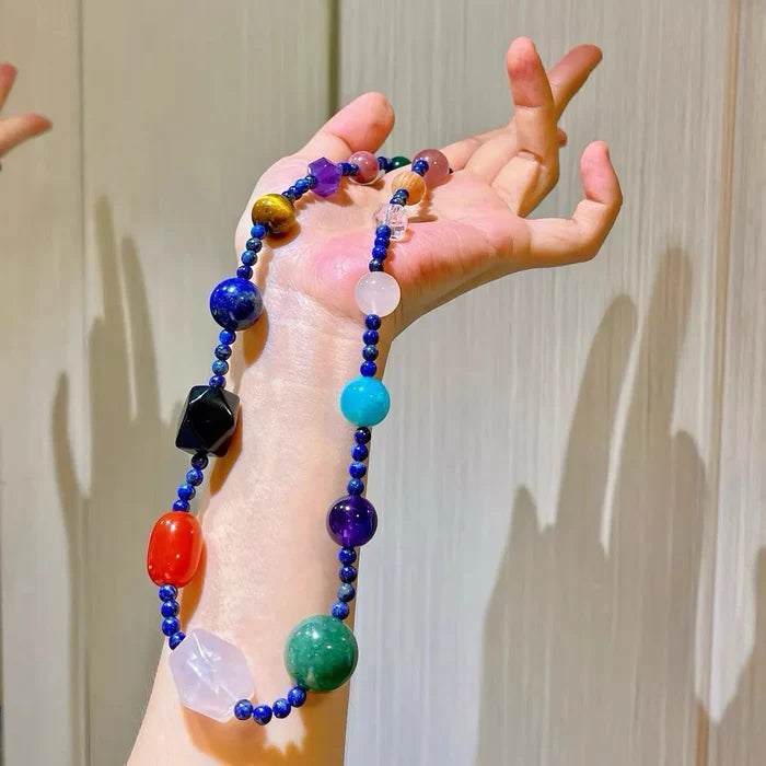 Full display of multi-gemstone crystal choker revealing lapis amethyst tiger eye and rose quartz beads, Crystalvana