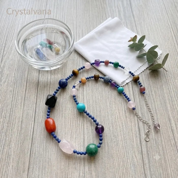 Crystal choker stored in blue velvet pouch, natural gemstone jewelry care and storage, Crystalvana
