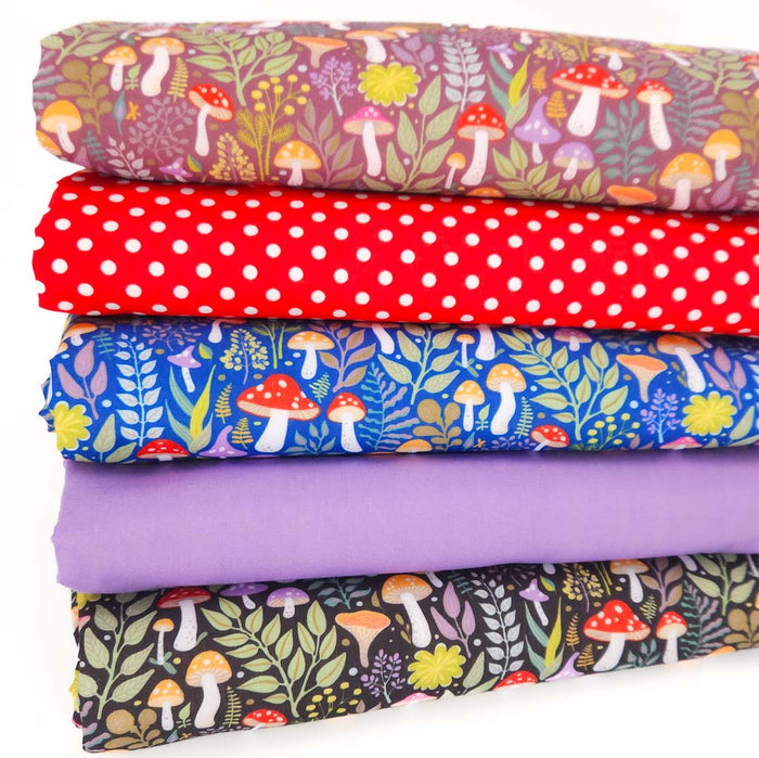 A fat quarter bundle with mushroom prints in vibrant colours