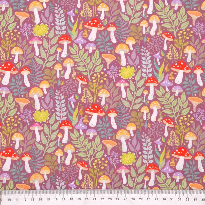 Colourful mushrooms printed on mauve polycotton with a cm ruler