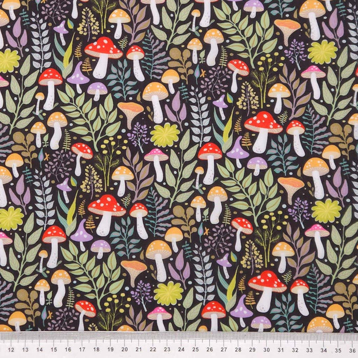Colourful mushrooms printed on black polycotton with a cm ruler