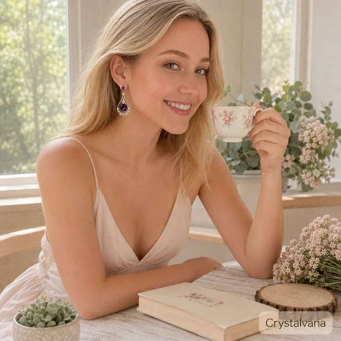 Model wearing natural amethyst halo teardrop earrings blonde with tea cup and book lifestyle, Crystalvana
