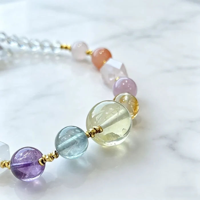 Citrine necklace styled on model wrist — handcrafted crystal necklace for positive energy by Crystalvana