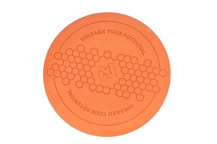 Orange Flying Disc, with hexagonal pattern and Non-stop dogwear Logo on a white background.