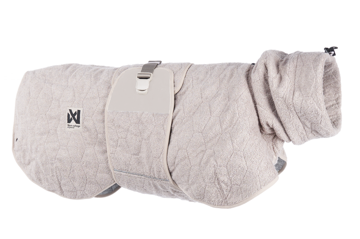 Stock image of the Drying Robe, in the sand colour, on a transparent background. Features hexagon lines, with Non-stop branding.