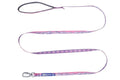 Stock image of the Trail Quest Lead, a pink and purple dog lead with mountain patterns, on a white background.