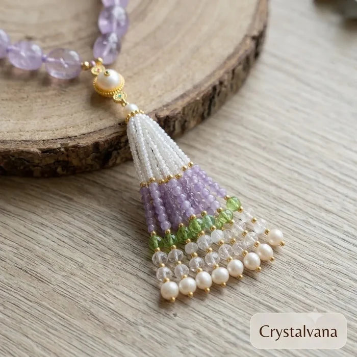 Close-up of hand-beaded tassel pendant with white pearl peridot and lavender beads, Crystalvana