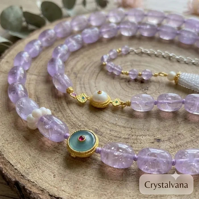 Lavender amethyst barrel bead necklace charms detail on wood surface, Crystalvana
