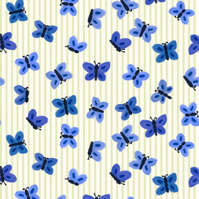 Blue butterflies printed on a cream cotton quilting fabric