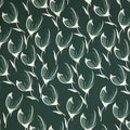 Pattern of white tulips on a dark green viscose twill fabric