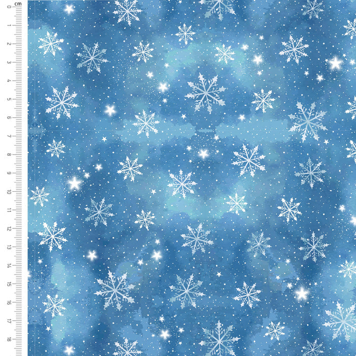Blue watercolor fabric with a white snowflake and star pattern, featuring a 10 cm measurement ruler on the left side.