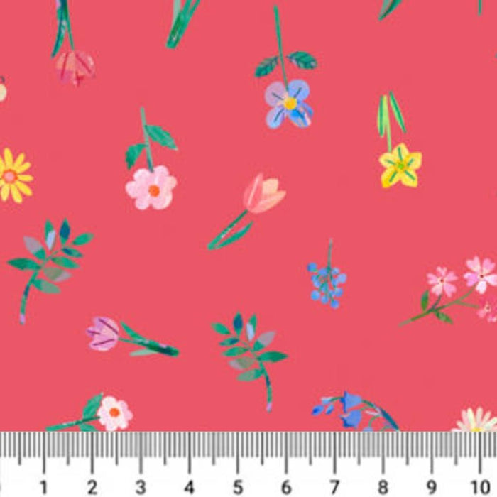 Floral pattern on a red cotton quilting fabric with a ruler at the bottom