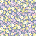 Pattern of small pastel flowers on a blue cotton quilting fabric