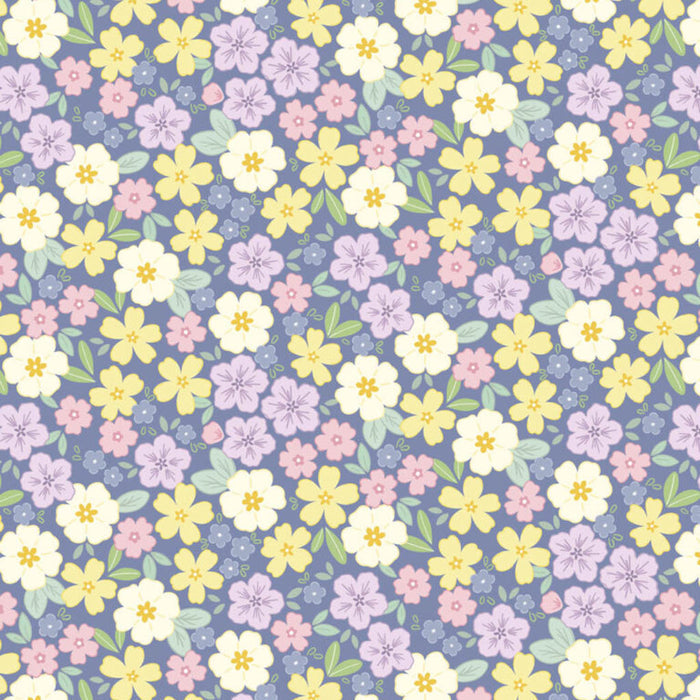 Pattern of small pastel flowers on a blue cotton quilting fabric