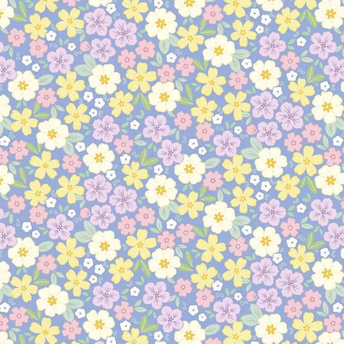 Pastel floral pattern on a blue cotton quilting fabric