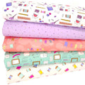 A sewing themed fat quarter fabric bundle in lilacs and mint