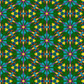 A brightly coloured geometric pattern printed on cotton quilting fabric