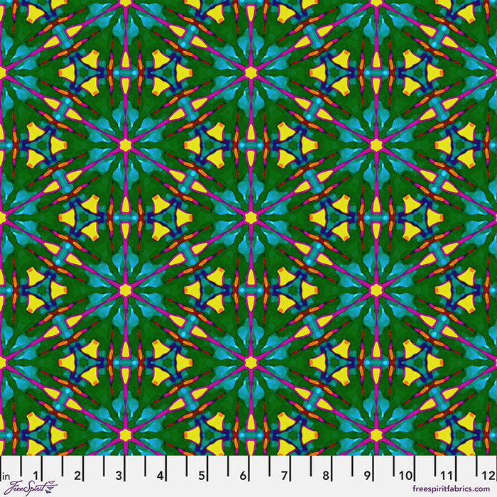 A brightly coloured geometric pattern printed on cotton quilting fabric with a cm ruler