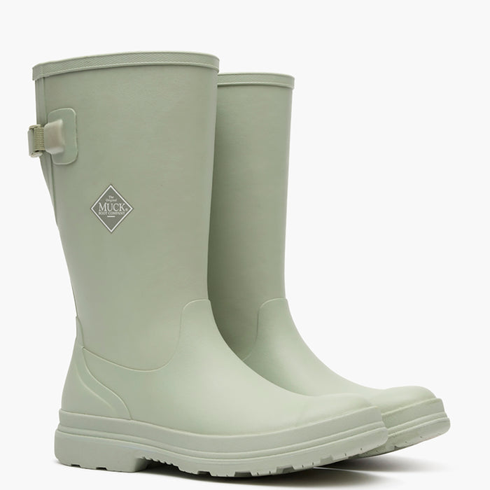 Pair of light green rubber boots on a white background