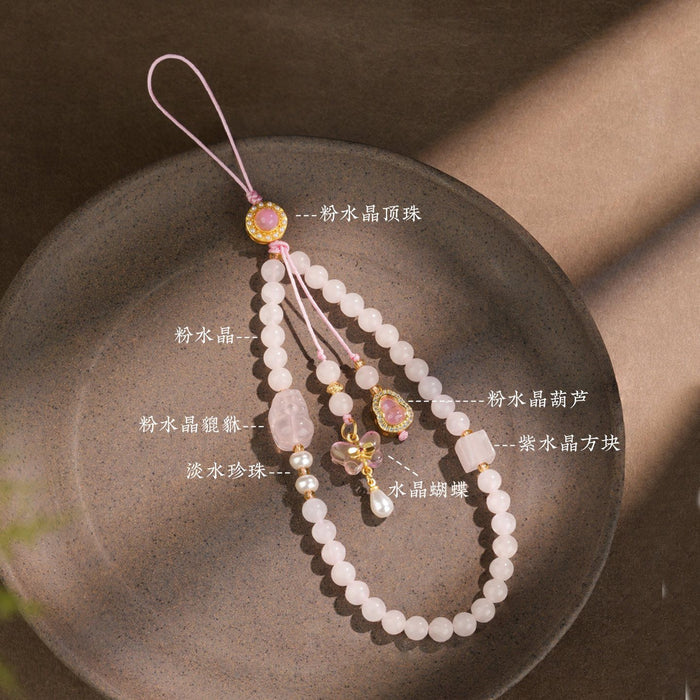 Rose quartz phone charm on bag