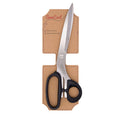 SewCool multi-use scissors with black handles and stainless steel blades, presented in a brown cardboard holder on a white background.