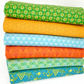 A fat quarter bundle of vribrantly coloured geometric quilting prints