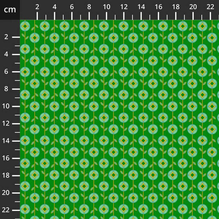 Green fabric with a small floral pattern and a ruler for scale on the left.