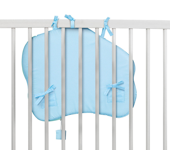 Sophie la Girafe Touch and Play Board showing the backside of the board while fastened to the side of the crib