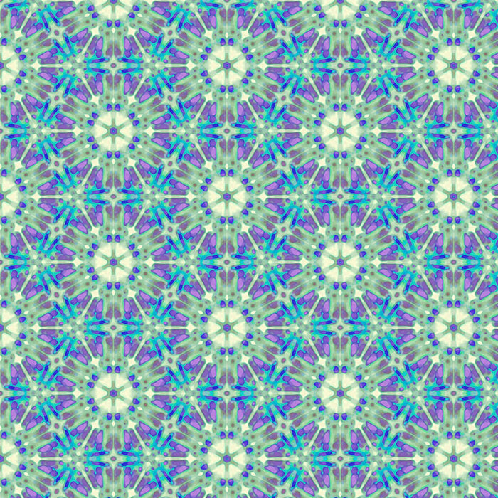 A geometric pattern in purples and greens printed on a cotton quilting fabric