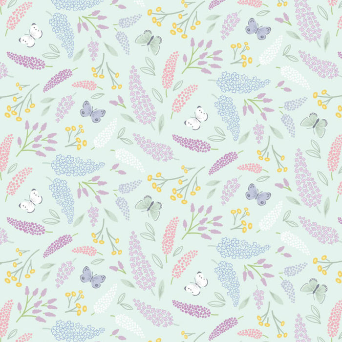 Pattern of flowers and butterflies on a light blue Butterflies printed on a lilac cotton quilting fabric