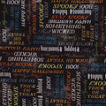 A close-up of a Halloween-themed fabric pattern featuring various spooky words like 'BOO!', 'SPOOKY', 'HAPPY HALLOWEEN', 'STAY SPOOKY', and 'TOIL AND TROUBLE' in white, orange, and light blue on a dark charcoal background.