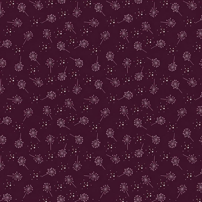 Pattern of small flowers on a dark purple cotton quilting fabric
