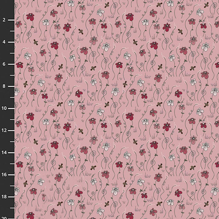 Floral patterned fabric with red and white flowers on a pink background