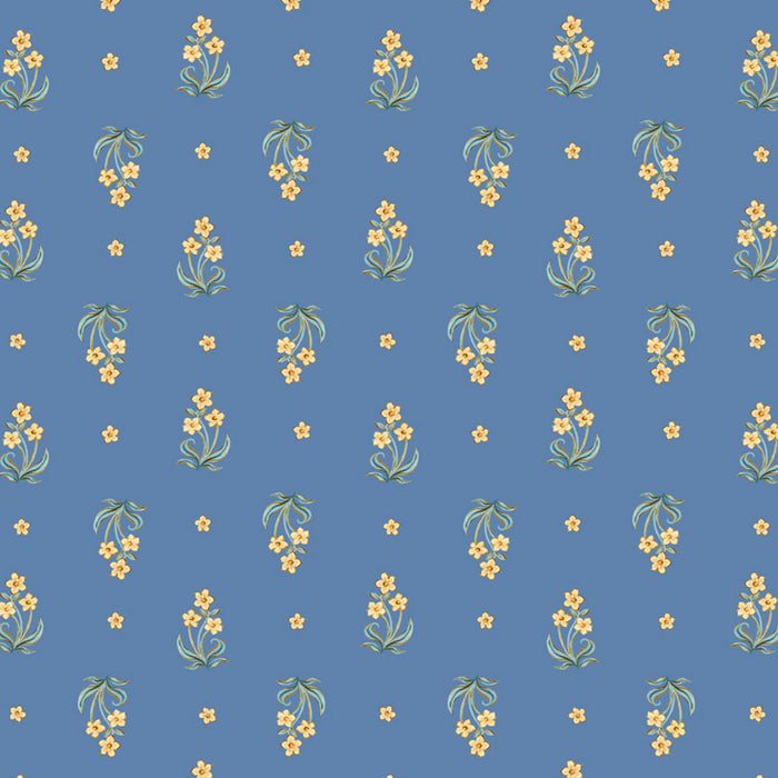 Small yellow flowers on a blue cotton quilting fabric