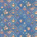 Decorative floral pattern on a blue cotton quilting fabric