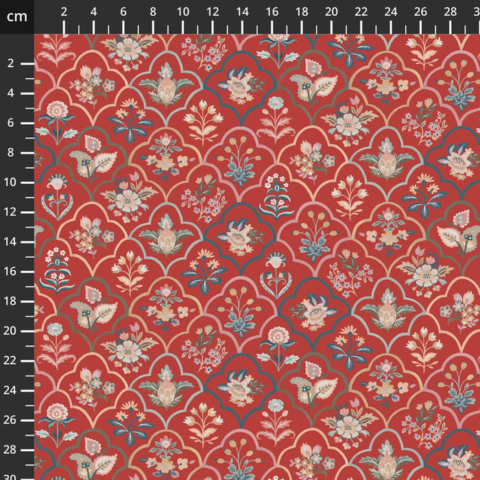 Floral patterned fabric with a ruler for scale on a red background