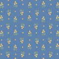 Small yellow flowers on a blue cotton quilting fabric