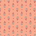 Pattern of small flowers on a peach cotton quilting fabric