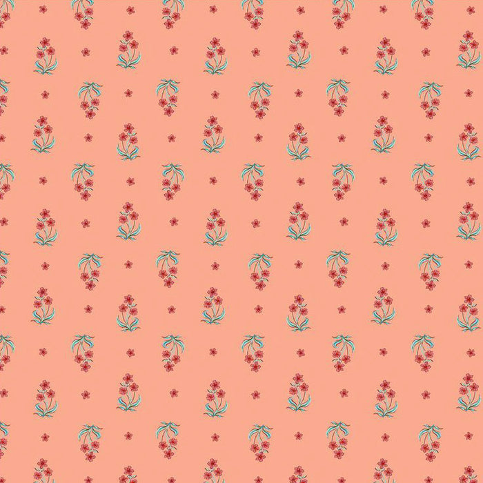 Pattern of small flowers on a peach cotton quilting fabric