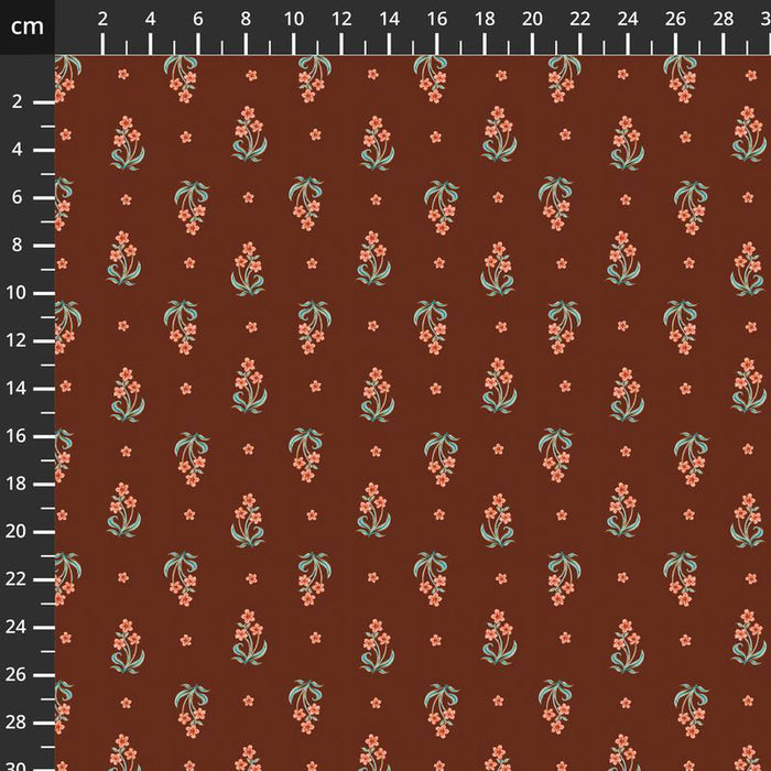Floral pattern fabric swatch on a brown background with a ruler for scale.