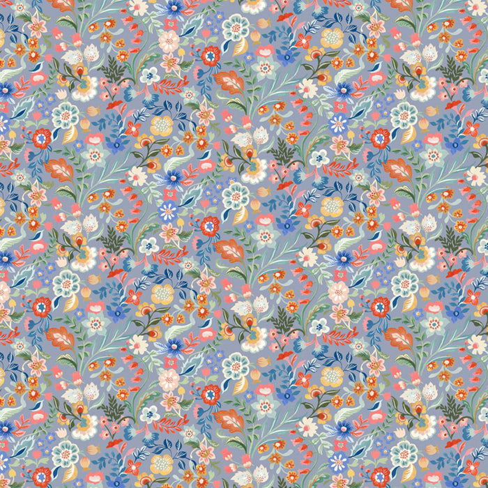 Pattern of colorful flowers on a blue cotton quilting fabric